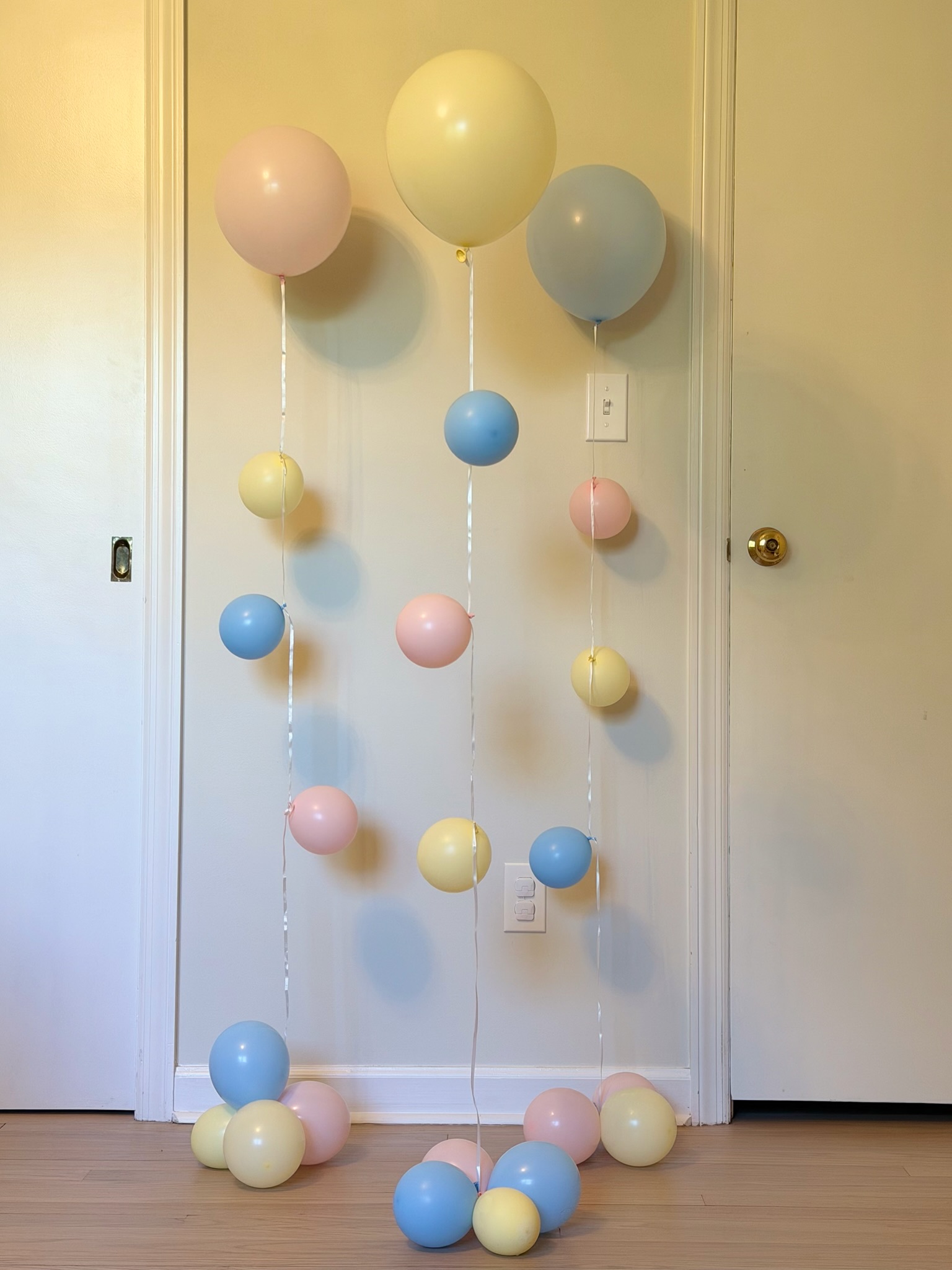 Pastel balloon strand garland in pink, blue and yellow